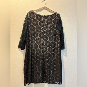 Black dress size 18w with round neck, half sleeves and zipper at the back.